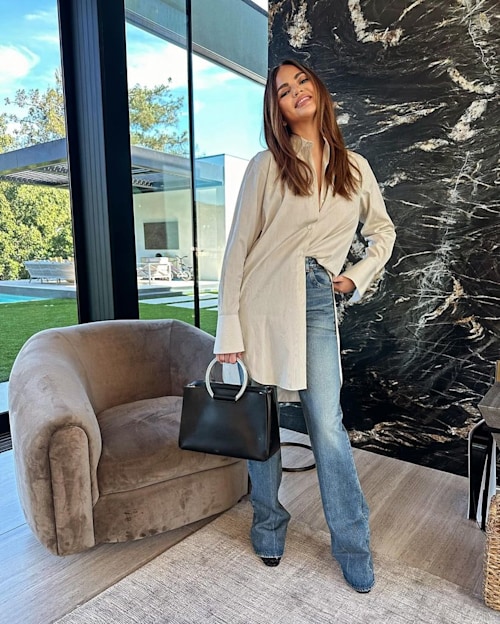 Chrissy smiling in home with patio view
