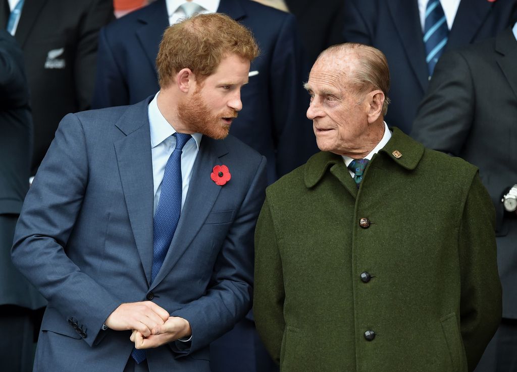 Prince Harry and Prince Philip at rugby