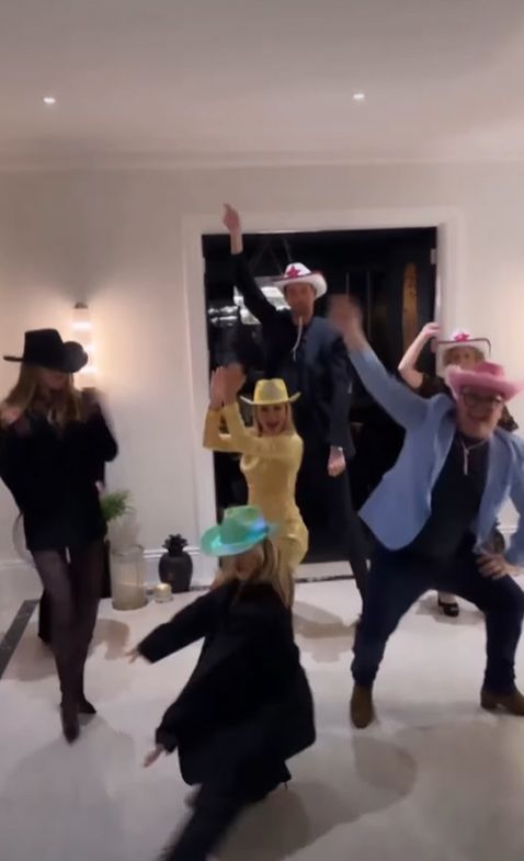 Amanda Holden dancing with a group of friends including Alan Carr, Abbey Clancy and Peter Crouch