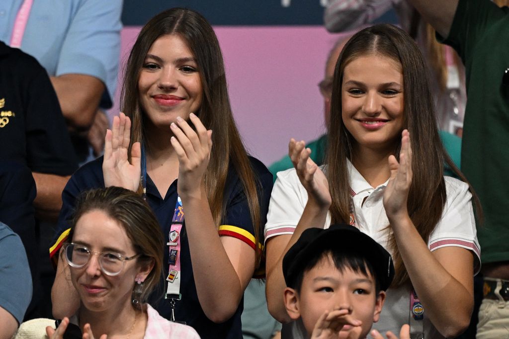 Spanish Crown Princess of Asturias Leonor (R) and Spanish Princess Sofia (L) applaud during the men's table tennis singles round of 32 match