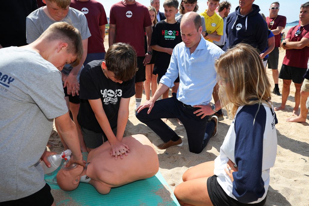 Prince William watches Hollywell Bay Surf Life Saving Club practice Cardiopulmonary resuscitation