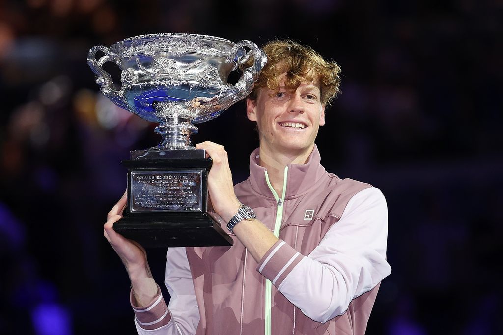 Jannik Sinner of Italy poses with the Norman Brookes Challenge Cup during the official presentation after their Men's Singles Final during the 2024 Australian Open