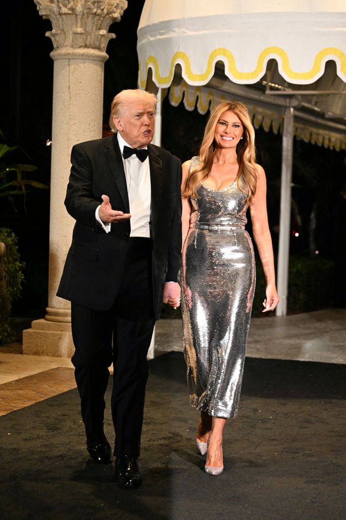 US President Donald Trump and First Lady Melania Trump attend the New Year's Eve Party at his Mar-a-Lago residence in Palm Beach, Florida 