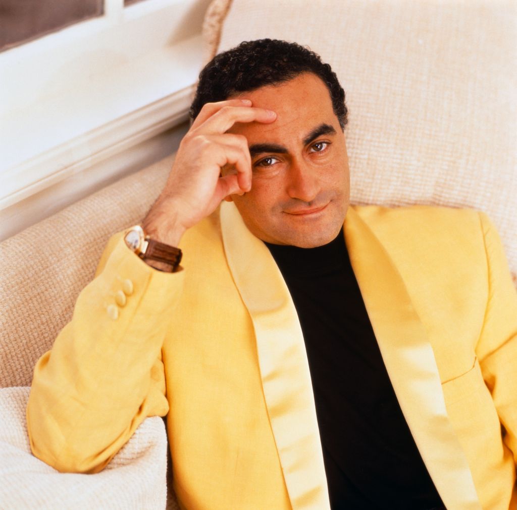 Dodi al-Fayed posing on an armchair