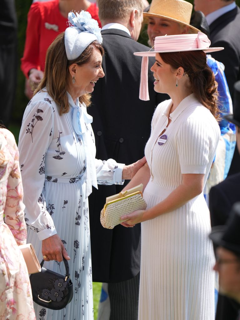 Carole Middleton smiles at Princess Eugenie