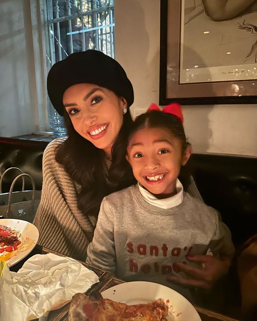 Vanessa enjoys pizza with her daughter