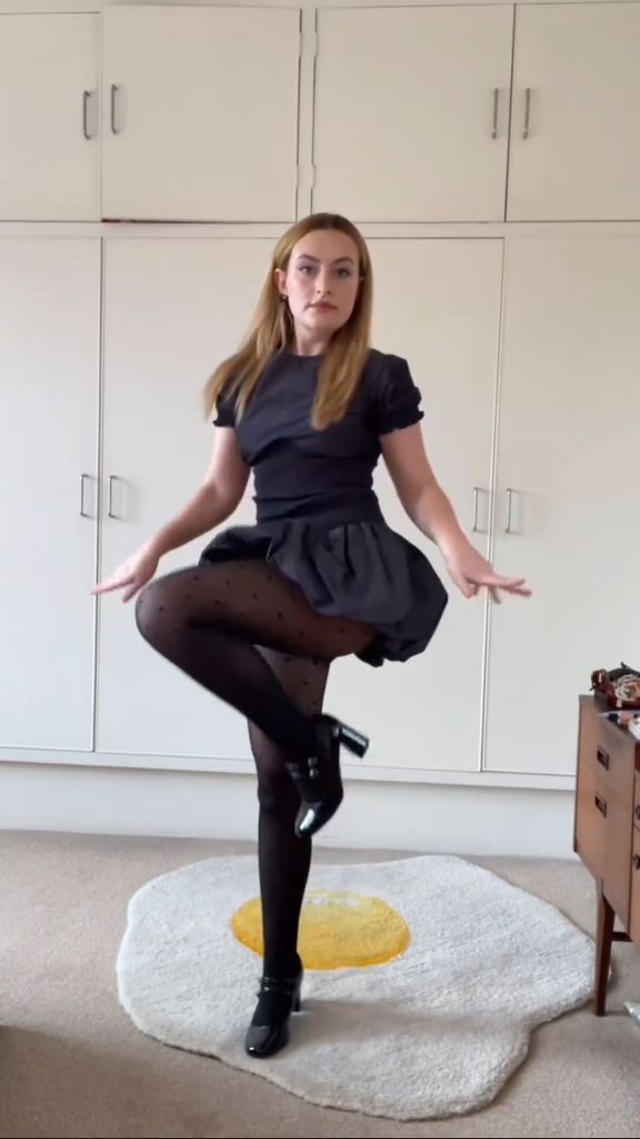 Amelia Dimoldenberg dances in her bedroom on an egg rug
