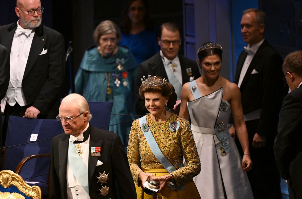 (L-R) King Carl XVI Gustaf of Sweden, Queen Silvia of Sweden and Crown Princess Victoria of Sweden arrive to attend the Nobel Prize award ceremony on December 10, 2025 in Stockholm, Sweden. The laureates will receive their prizes at formal ceremonies in Stockholm and Oslo on December 10. That date is the anniversary of the death in 1896 of scientist Alfred Nobel, who created the prizes in his will. (Photo by Jonathan Nackstrand / AFP via Getty Images)