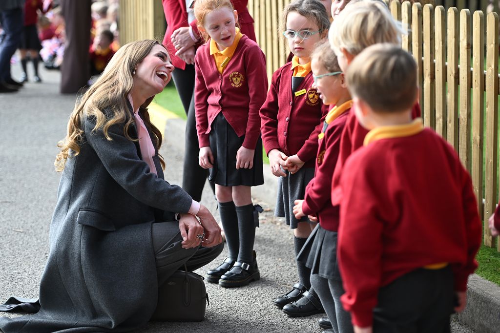 Kate Middleton smiling with schoolchildren in Southport