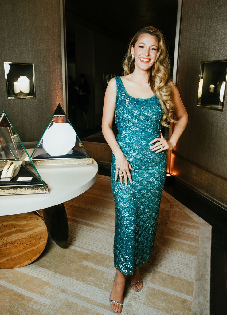Blake Lively smiling in a scalloped mermaid dress