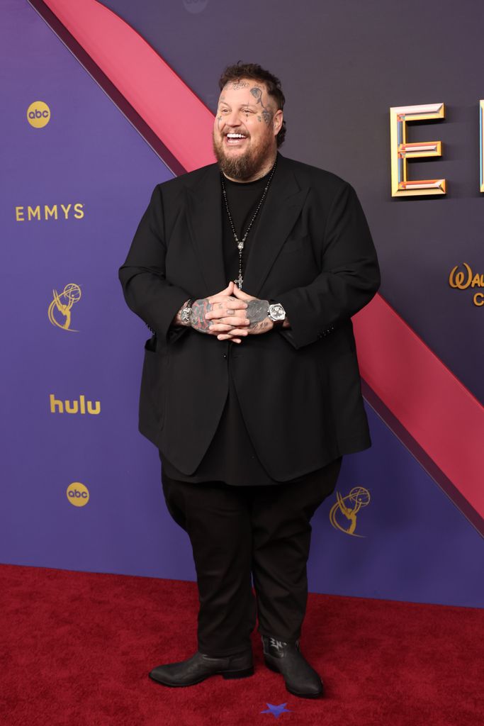     Jelly Roll shows a slimmer body in a tight black suit