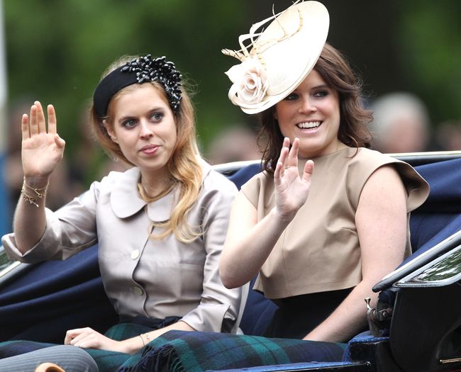 princess beatrice and eugenie wearing fascinators and beige dresses at trooping the colour