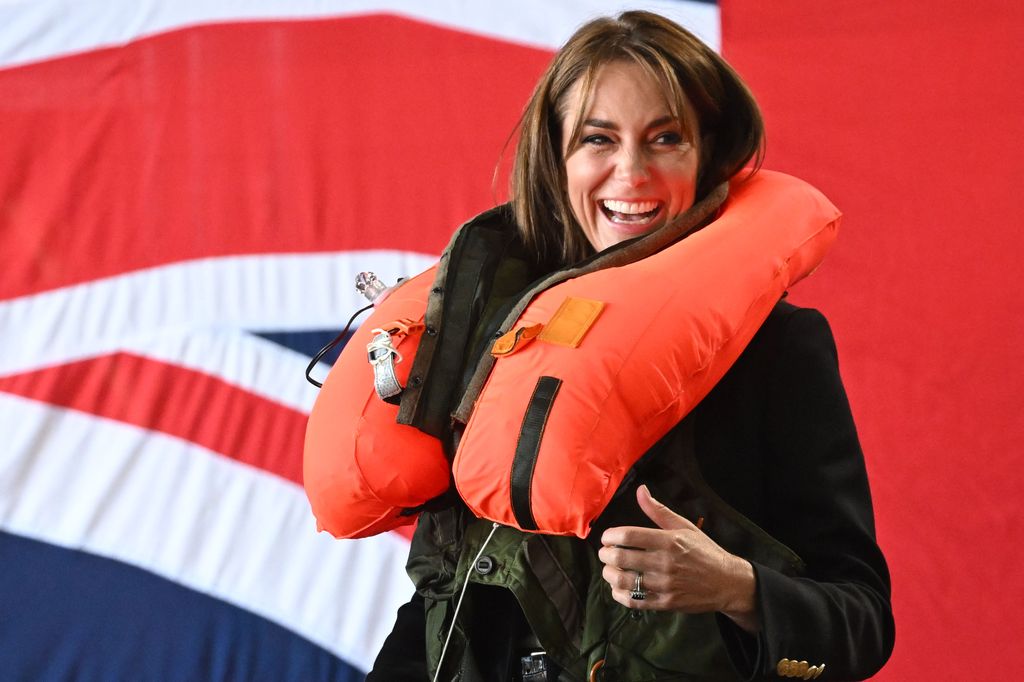 Kate tries out a life jacket at royal naval air station