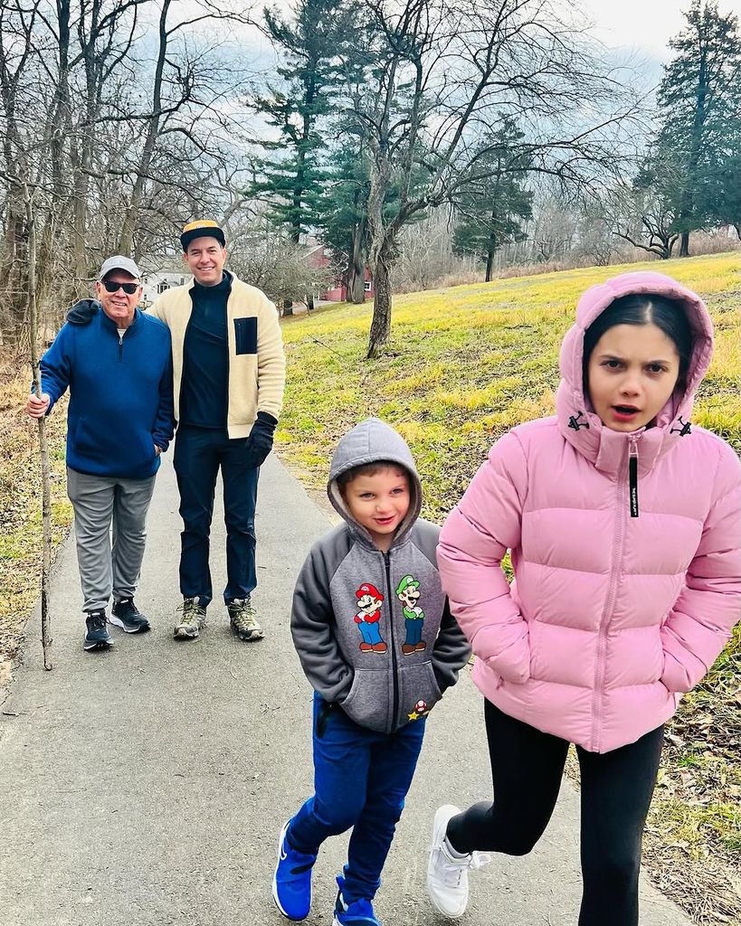 Tom Llamas and his kids walking through the suburbs 