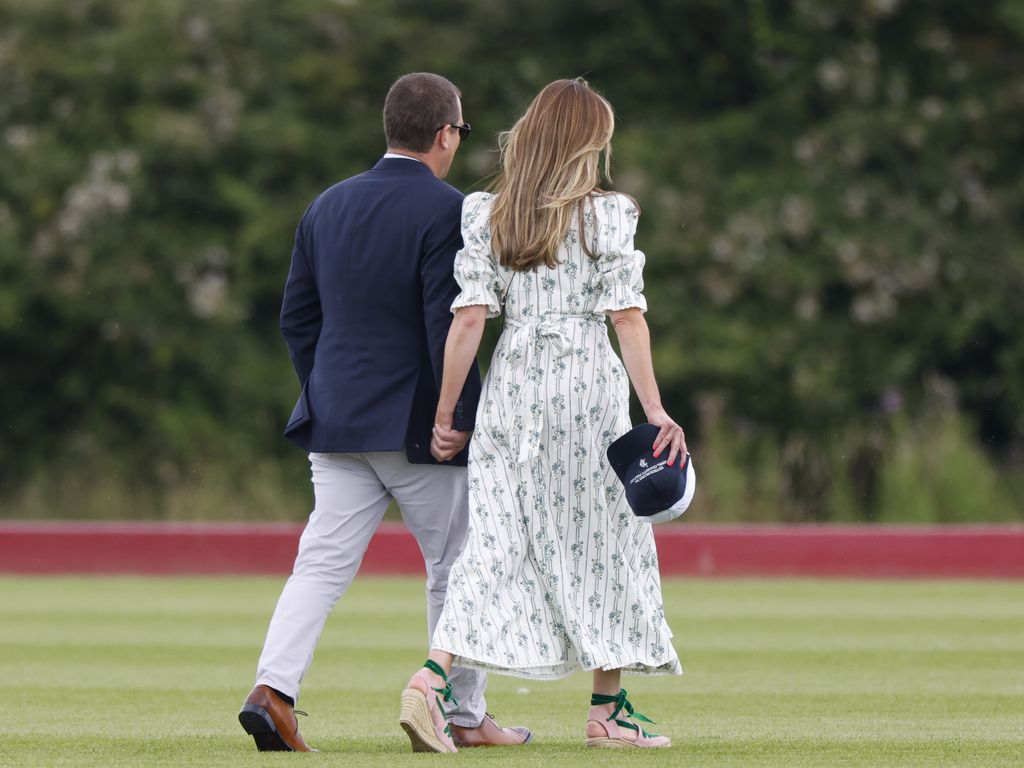 Peter Phillips and Harriet Sperling holding hands