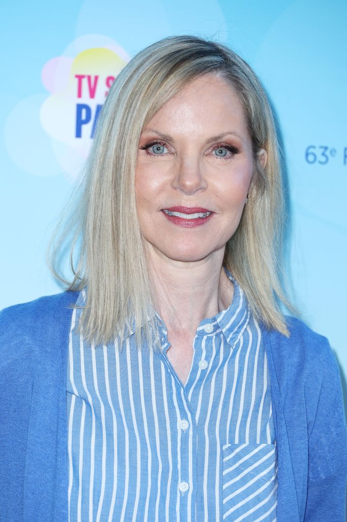 Melissa Sue Anderson attends the Red Carpet wearing a striped blue shirt and blue cardigan