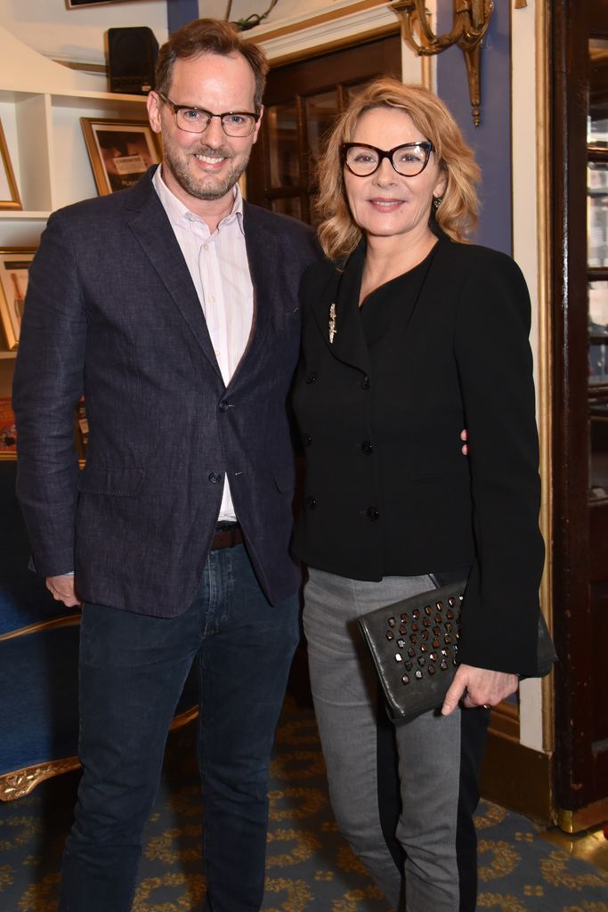 Russell Thomas and Kim Cattrall standing smiling for a photo