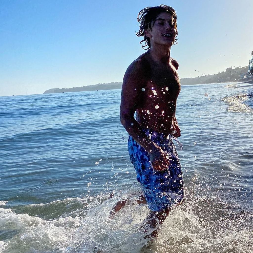 Kingston Rossdale captured running on the beach by his father Gavin Rossdale