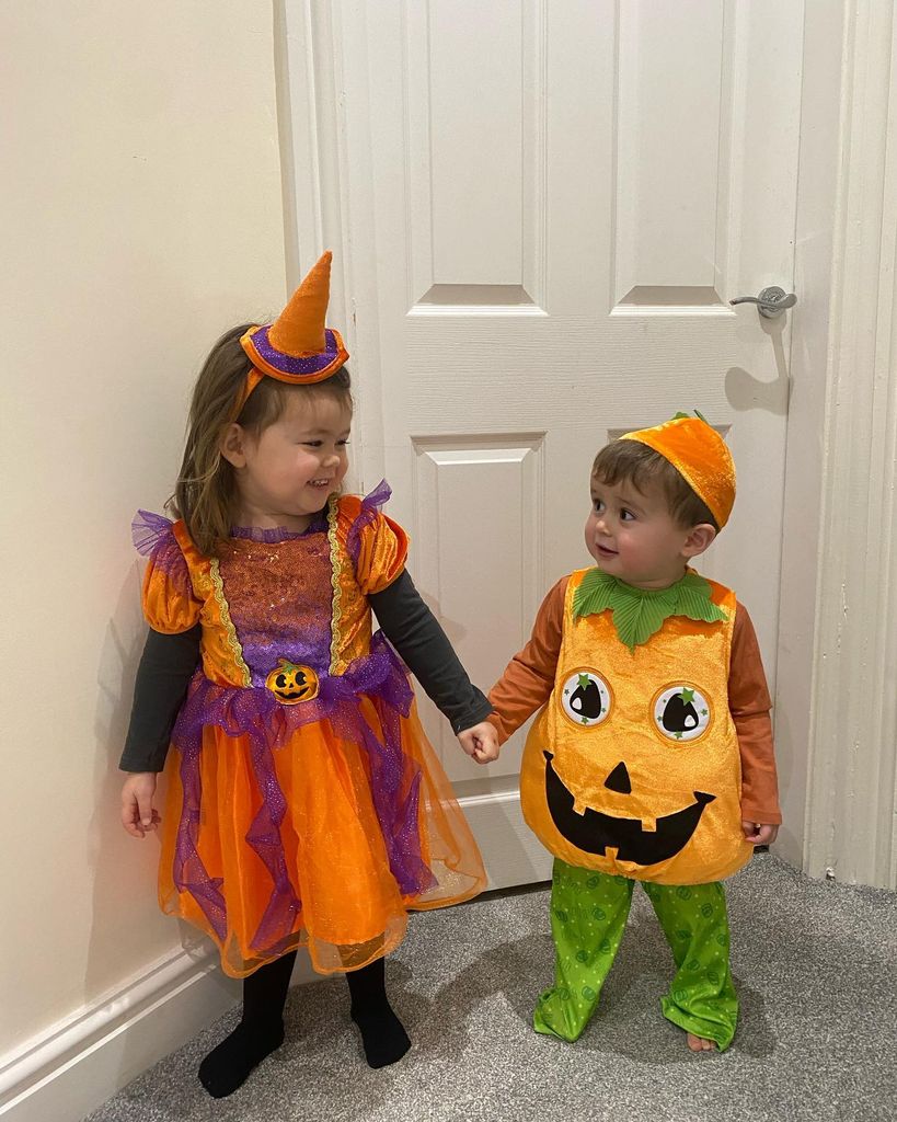 Sam's children in pumpkin costumes