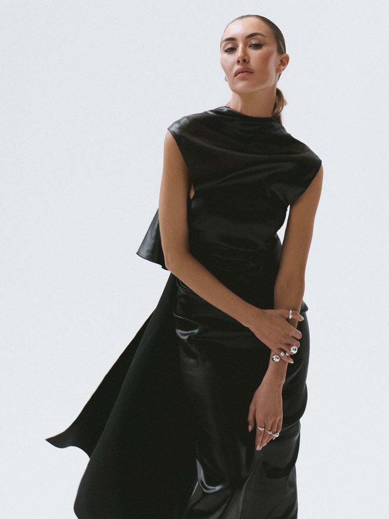 Dress: Sportmax, £950.
Right Hand Thumb Ring:Dinosaur Designs, £245.
Right Hand (Ring Finger, Pinkie): Paula Mendoza, £108.
Other Rings: Lo Collections, from £45