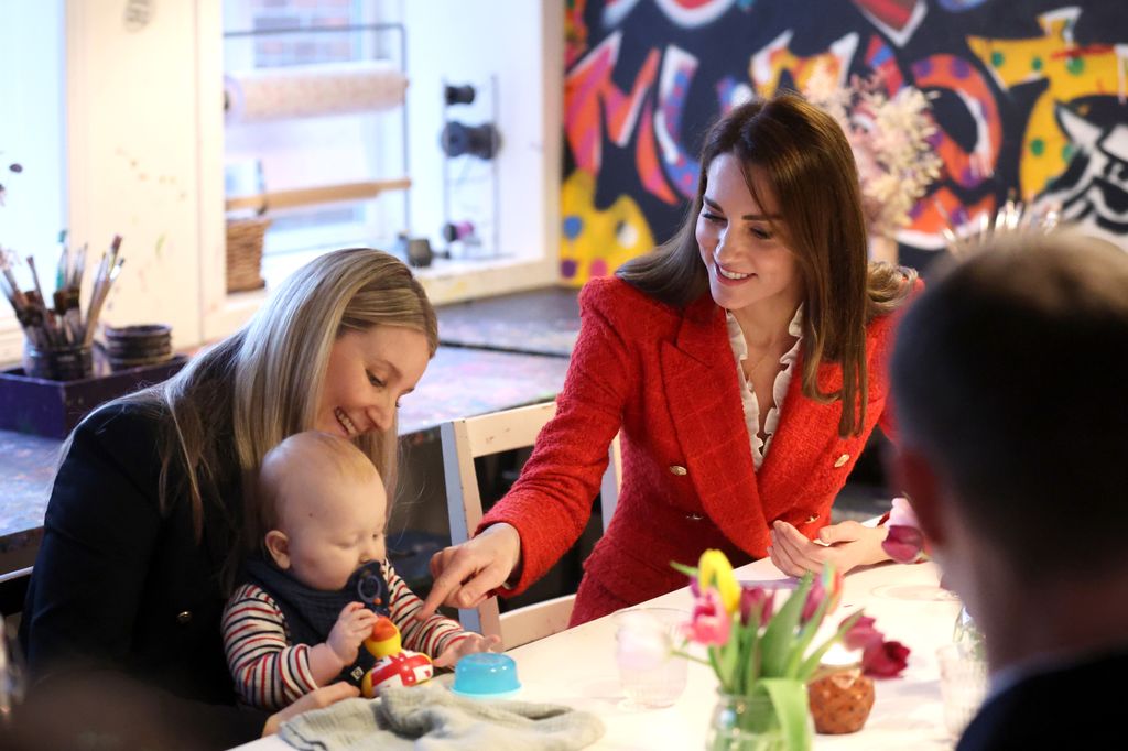 Kate Middleton coos over baby in Copenhagen, Denmark