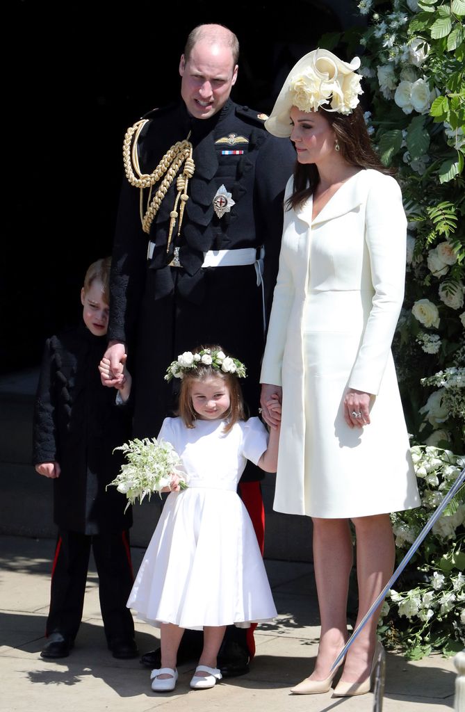 Prince William, Duke of Cambridge and Catherine, Duchess of Cambridge with Prince George and Princess Charlotte leave St George's Chapel, Windsor Castle after the wedding of Prince Harry, Duke of Sussex and the Duchess of Sussex on May 19, 2018 in Windsor, England