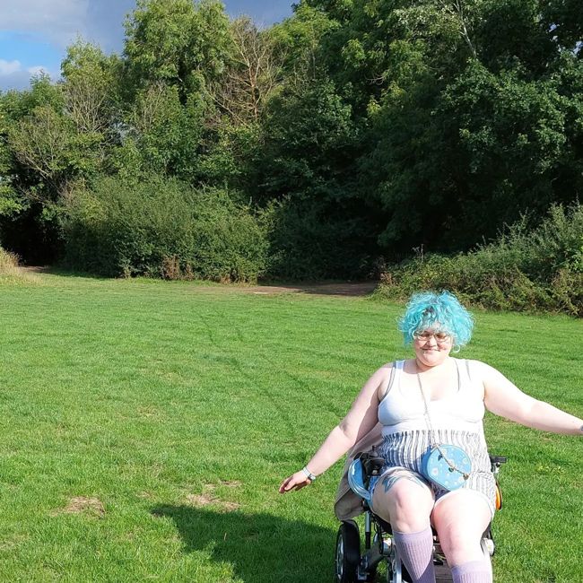 Betty Ross in a wheelchair on a summery day