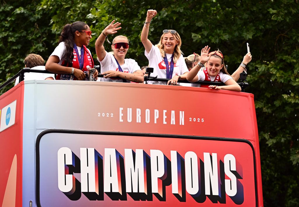 Khiara Keating, Georgia Stanway, Chloe Kelly and Ella Toone of England acknowledge the fans during the England Women's team victory parade and celebration on July 29, 2025 in London, England.