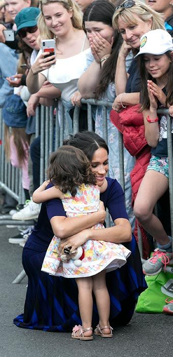 2 Meghan hug child australia