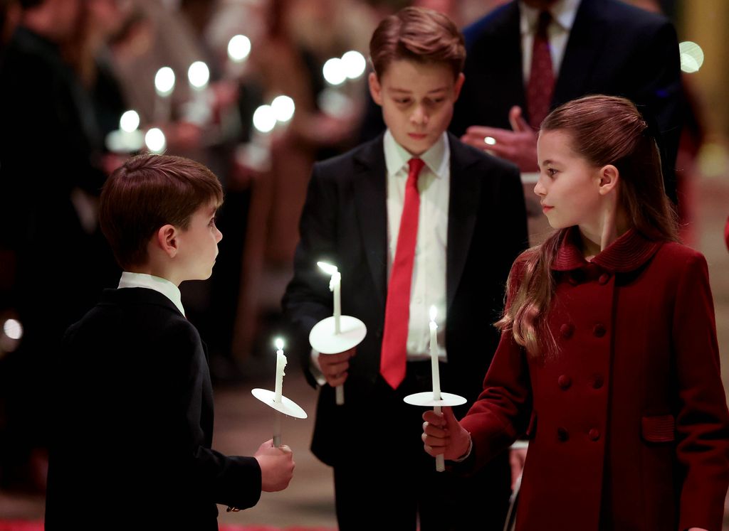 Prince Louis and Princess Charlotte during carol service with Prince George following closely behind