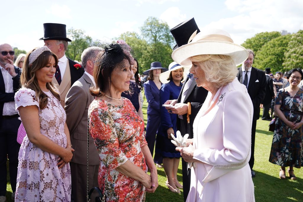 Queen Camilla talks with Dame Arlene Phillips at The Creative Industries Garden Party at Buckingham Palace on May 15, 2024 