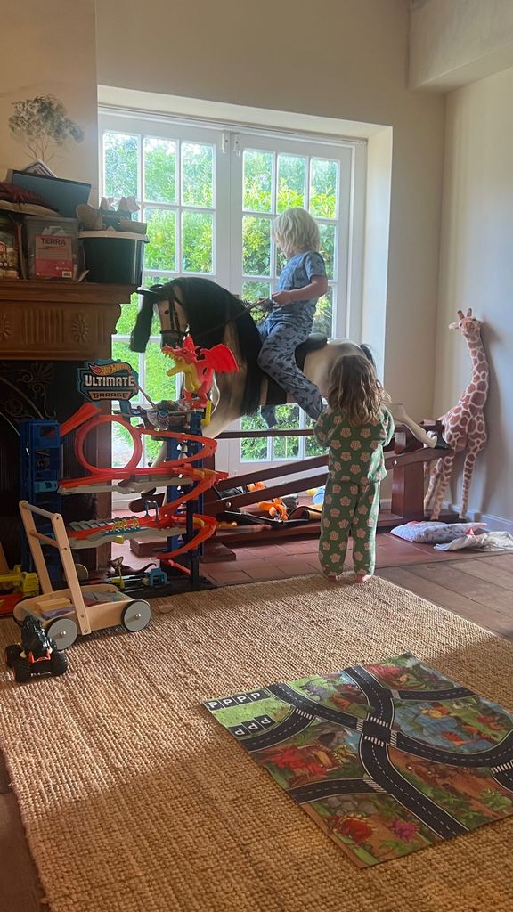 Carrie Johnson's kids playing on a rocking horse