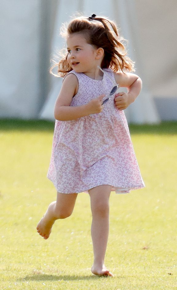 Princess Charlotte in field barefoot running