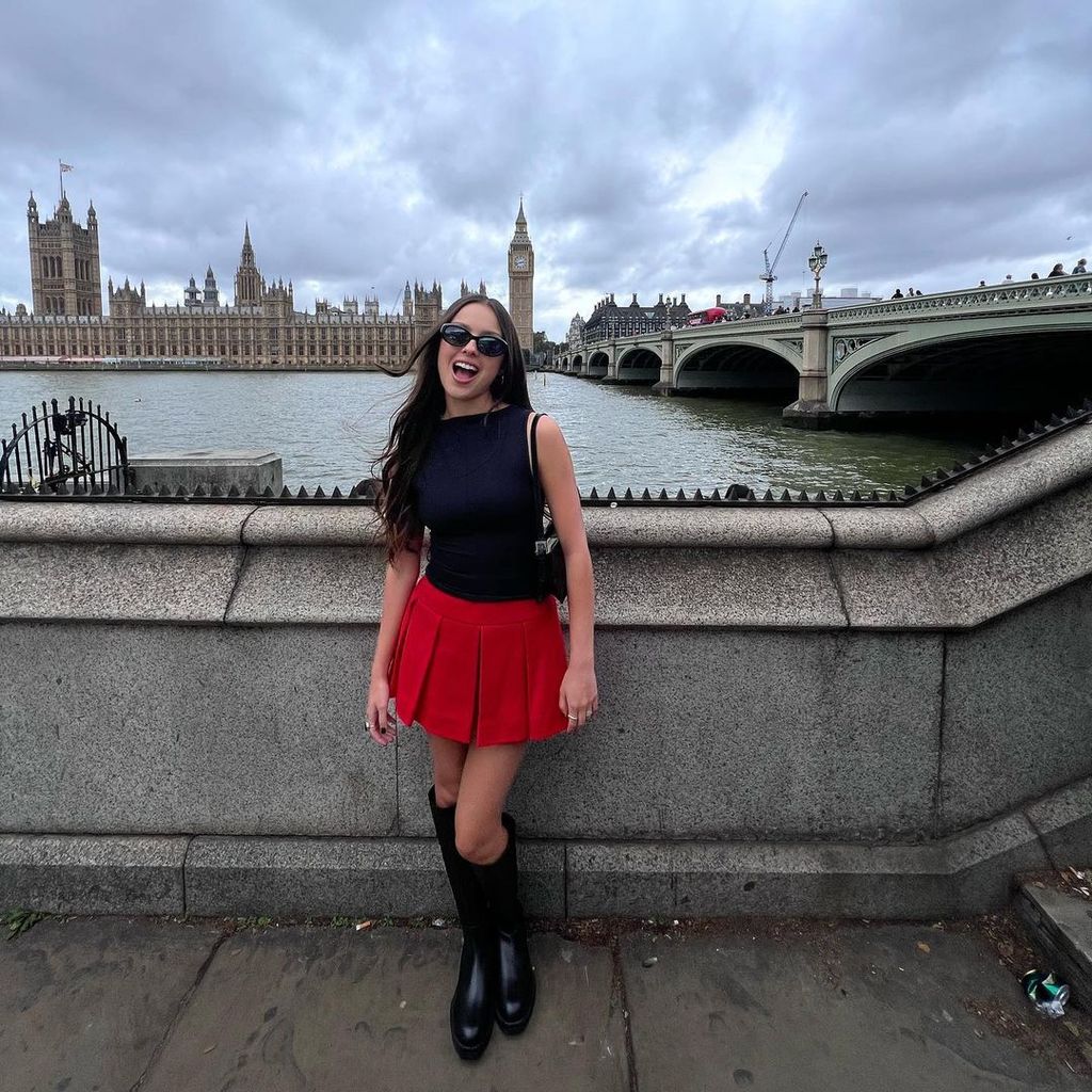 Olivia shared images in her red pleated skirt on Instagram