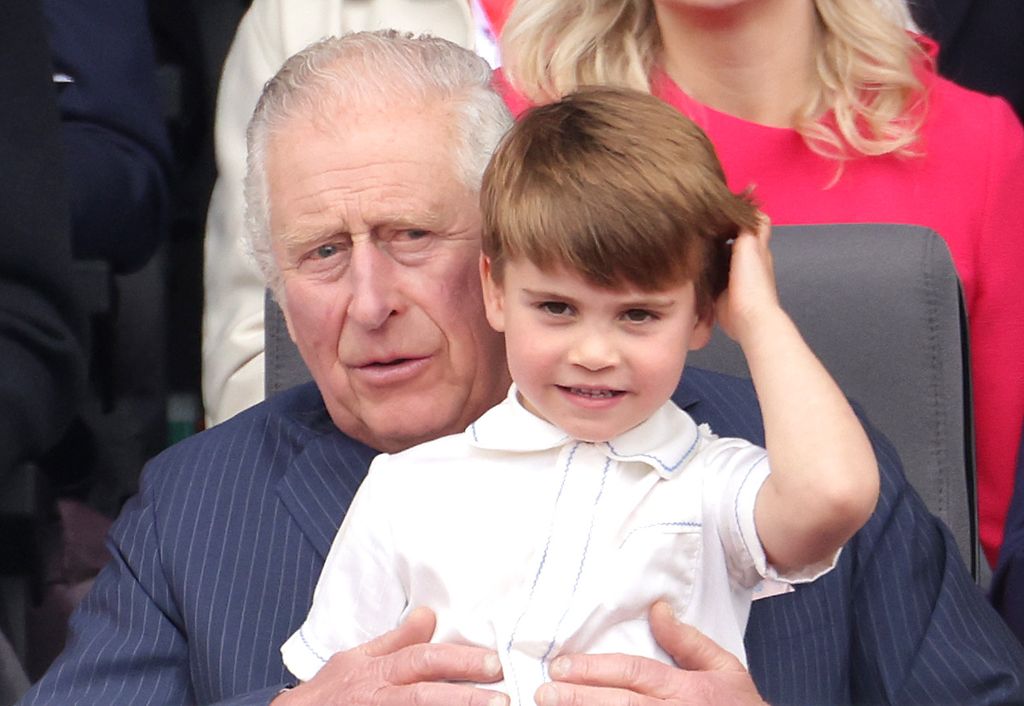 Prince Louis sat on King Charles' lap