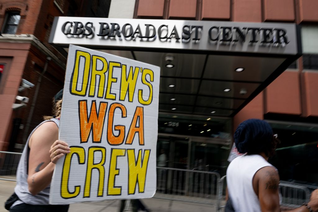 Members of the WGA-EAST and SAG-AFTRA picket outside of The Drew Barrymore Show as audience members arrive ahead of the show at CBS Broadcast Center on September 12, 2023 in New York City