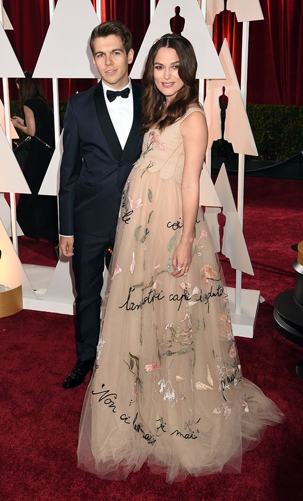 Keira Knightley shows off her baby bump at the 87th Annual Academy Awards with James Righton