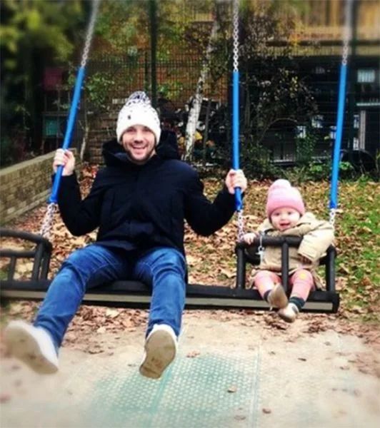 Helen George's ex Jack Ashton on swing with baby