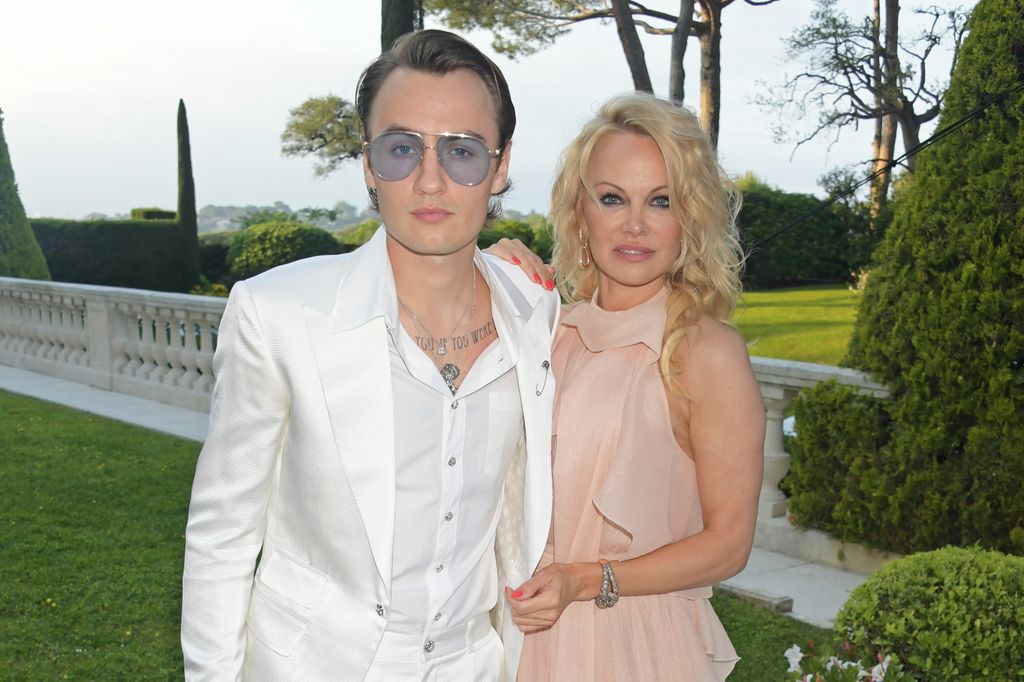 Brandon Thomas standing with Pamela Anderson