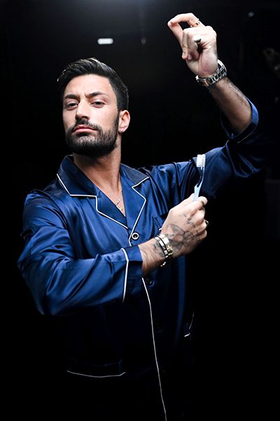 Giovanni Pernice holding toothbrush