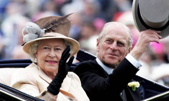 Prince Philip and the Queen wave to crowds