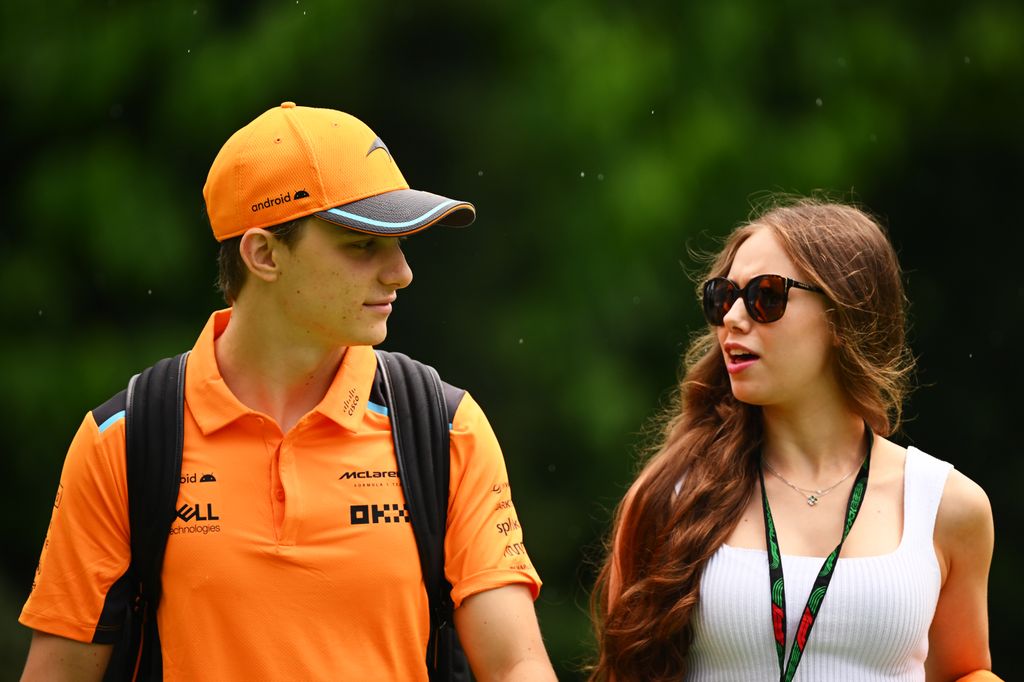 Oscar Piastri walking alongside Lily Zneimer
