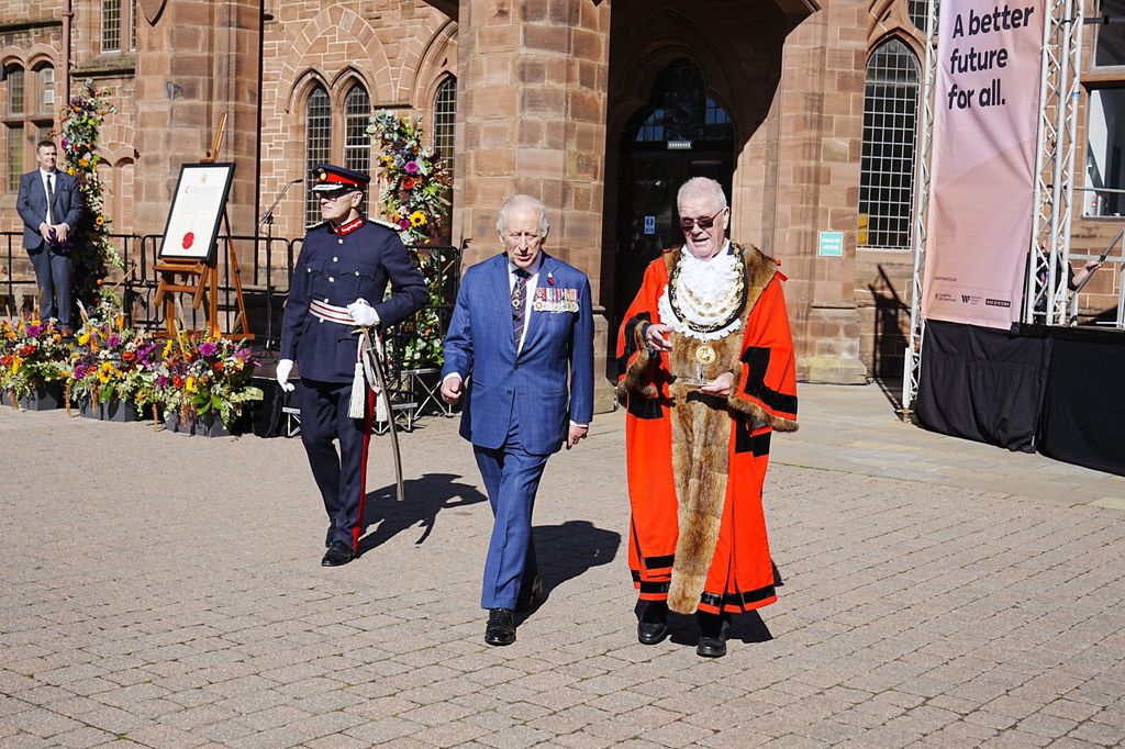 King Charles with mayor in red ceremonial gown outside the Town Hall in Barrow-in-Furness