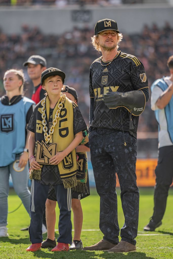 Owen Wilson and son watch falcon fly during a game between Austin FC and Los Angeles FC at Banc of California Stadium on October 29, 2022 in Los Angeles, California