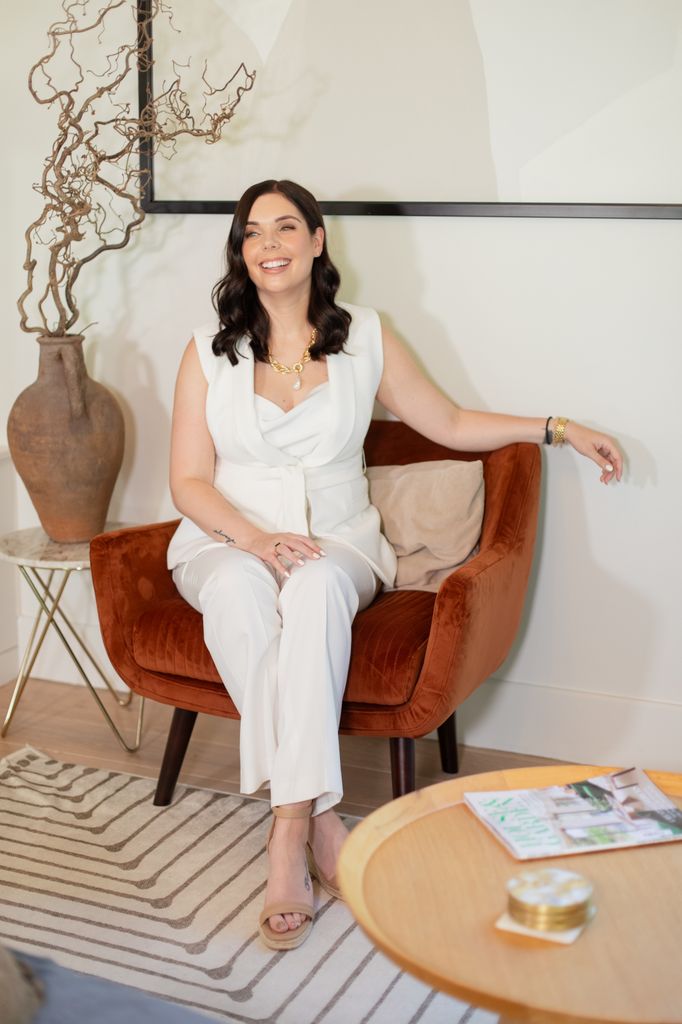 Emma sitting on a velvet chair