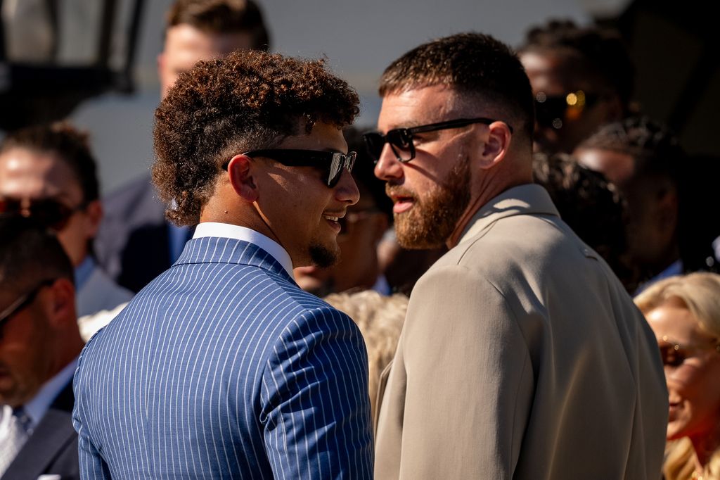 NFL Kansas City Chiefs quarterback Patrick Mahomes (L) and tight end Travis Kelce (R) appear at an event with U.S. President Joe Biden on the South Lawn of the White House 