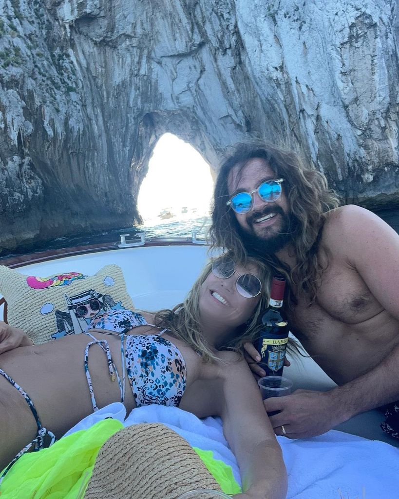 Heidi Klum and husband Tom cuddled up on a boat trip around Capri 