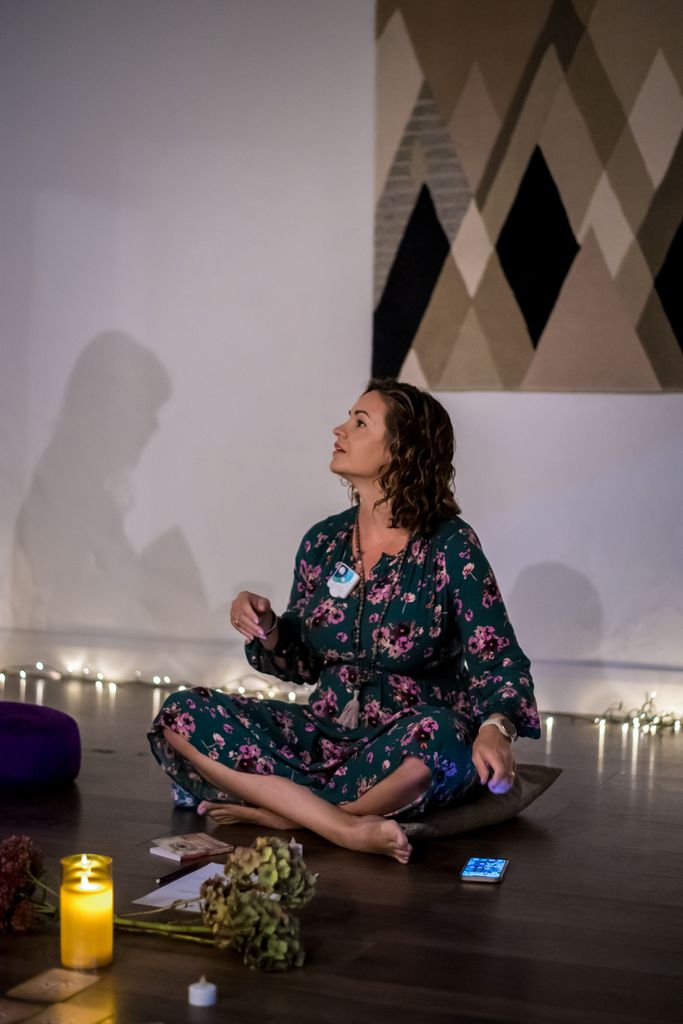 Sarah leading a tapping session on retreat 