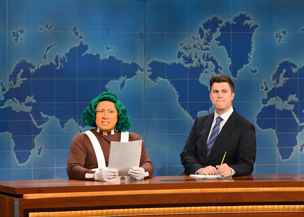 Bowen Yang as an Oompa Loompa and anchor Colin Jost during Weekend Update on Saturday, October 16, 2021 