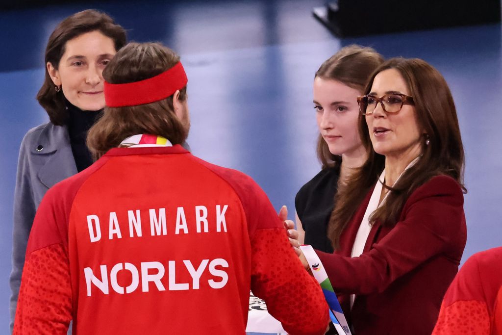 Queen Mary comforts Danish handball player